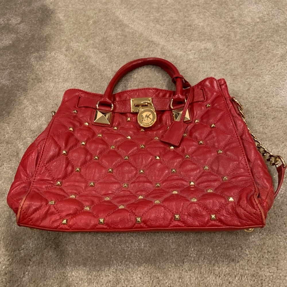 Good condition Michael Kors Red Hamilton with gold studs
